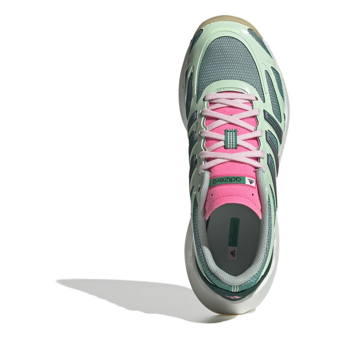 Green and pink low-top sneakers, top view showing pink laces and mesh upper