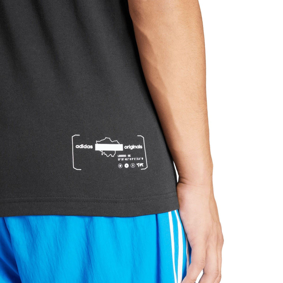 Men's black adidas Originals T-shirt close-up of front graphic and hem