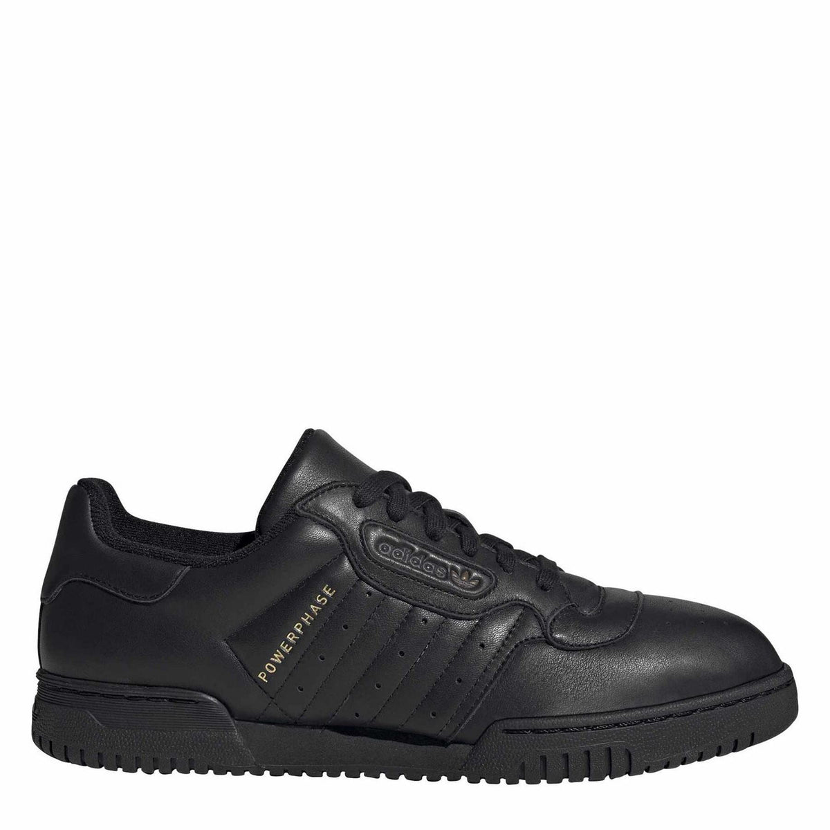Black low-top leather sneakers with lace-up front and textured rubber sole