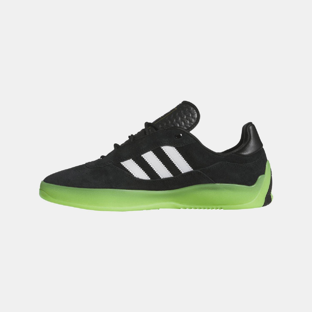Black low-top sneaker with white adidas stripes and neon green sole