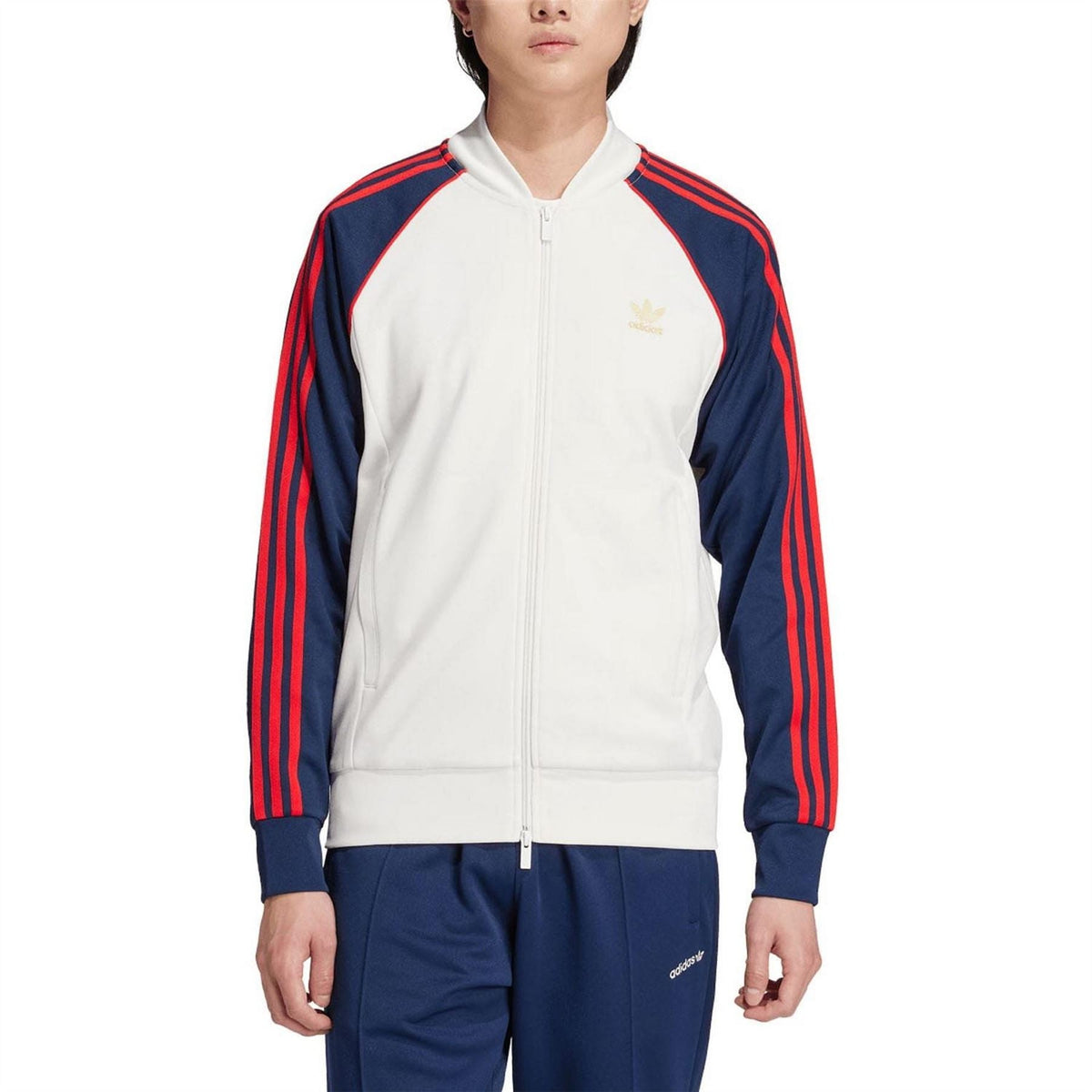 White track jacket with full zip and navy/red stripe sleeves; adidas logo on chest