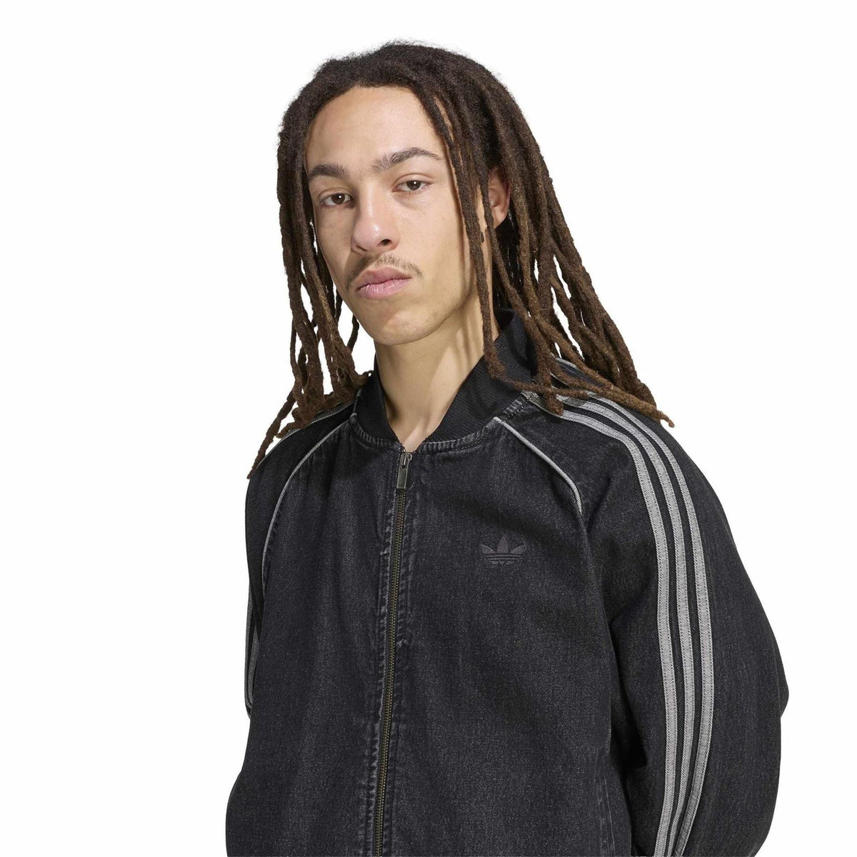 Black denim bomber jacket with adidas logo, three-stripe sleeves, and full-zip front.