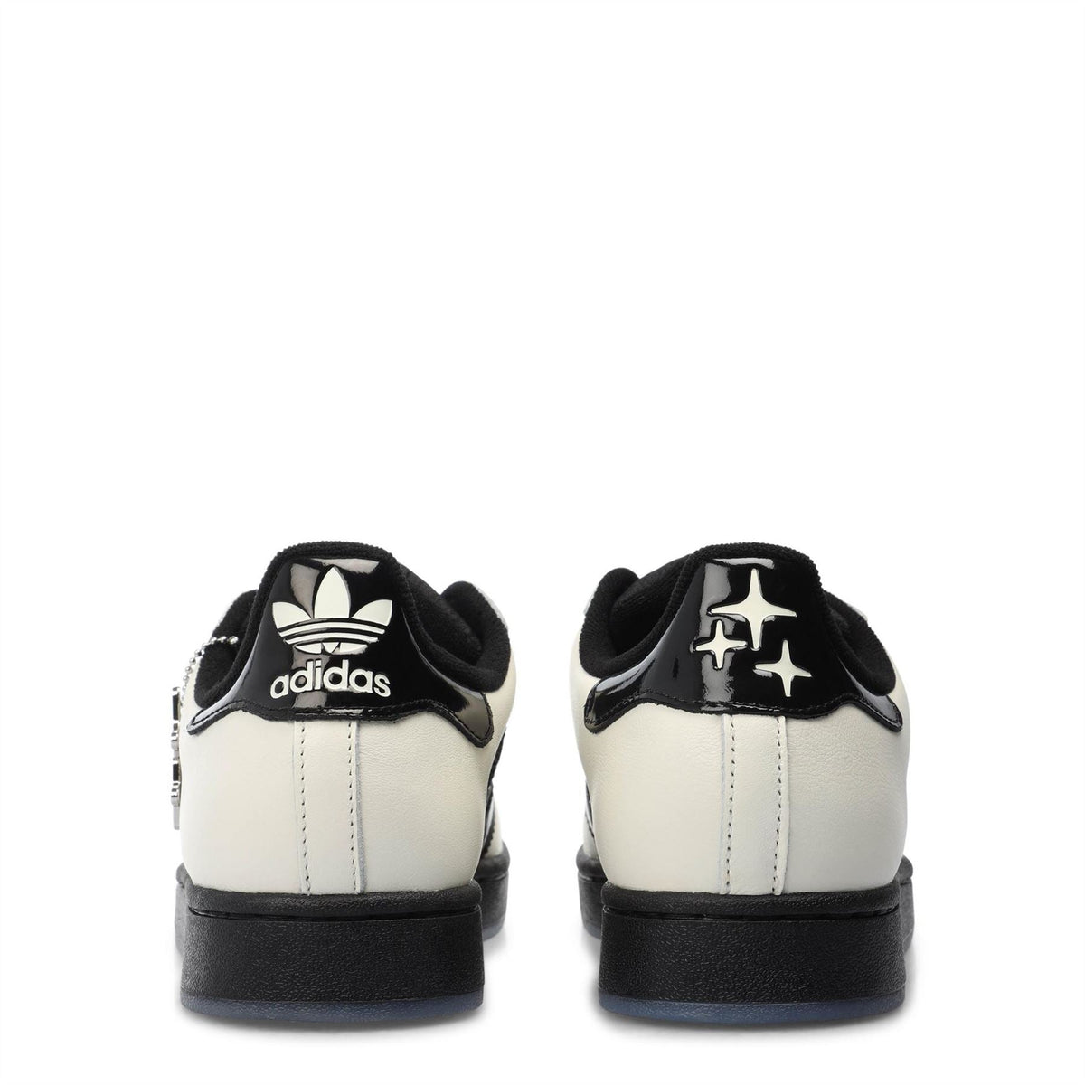 adidas low-top sneakers, off-white with black heel tab and adidas trefoil logo