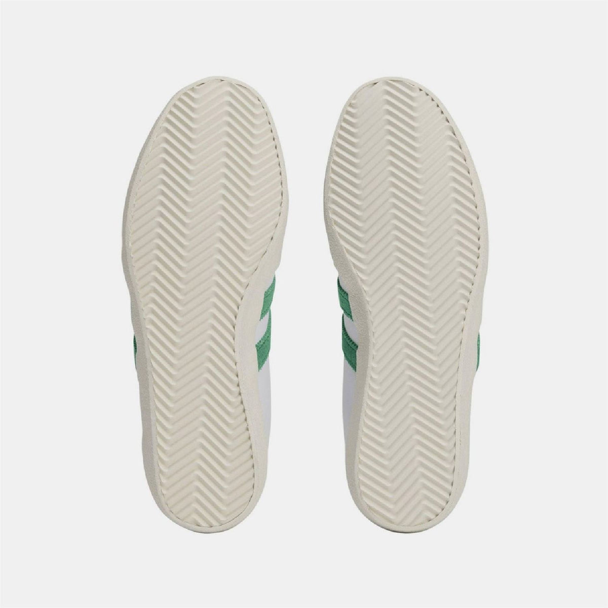 White sneaker outsoles with textured herringbone tread
