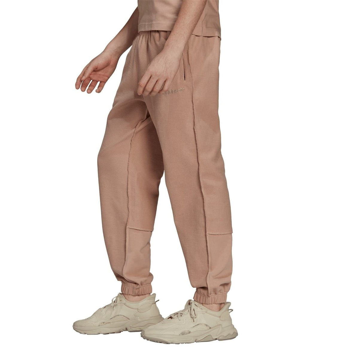 Dusty pink relaxed jogger pants with elastic waistband and ankle cuffs