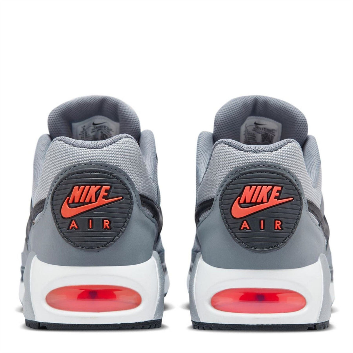 Light grey trainers with NIKE AIR heel badge and red air unit detail