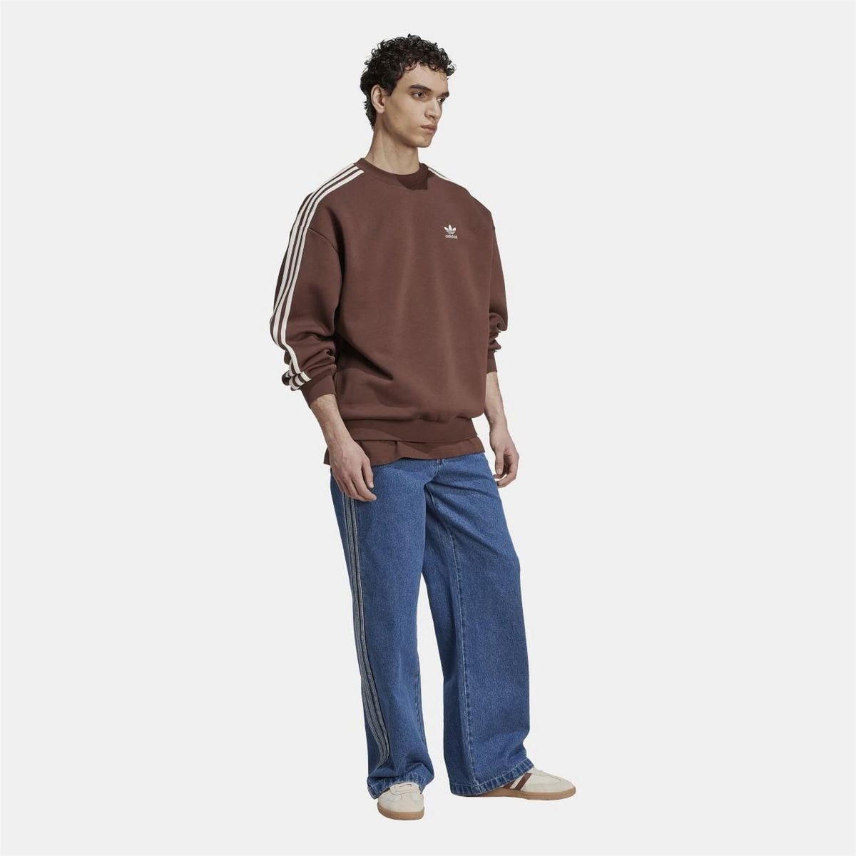 Brown adidas crewneck sweatshirt with white shoulder stripes and ribbed cuffs