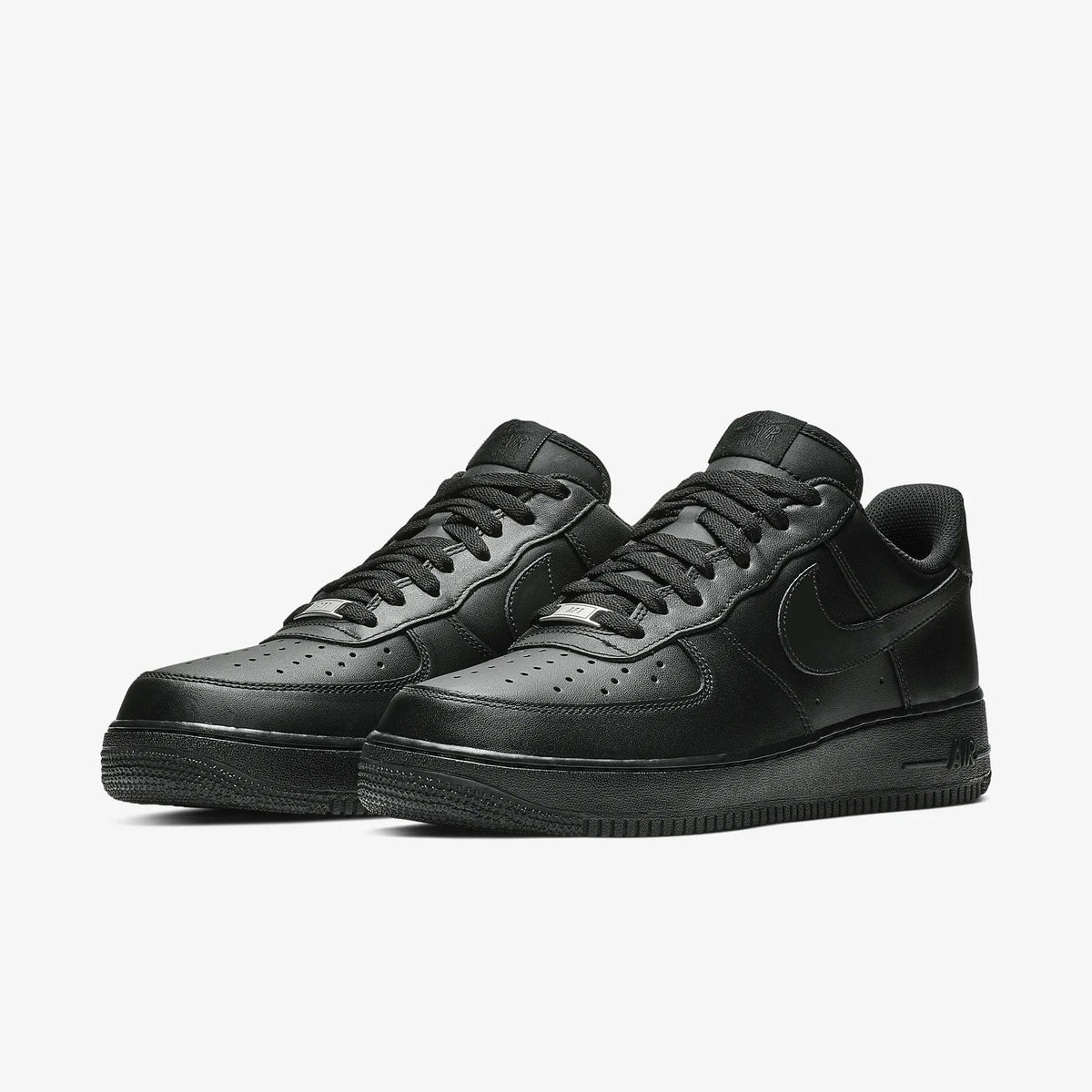 Pair of black low-top sneakers with lace-up closure and classic swoosh