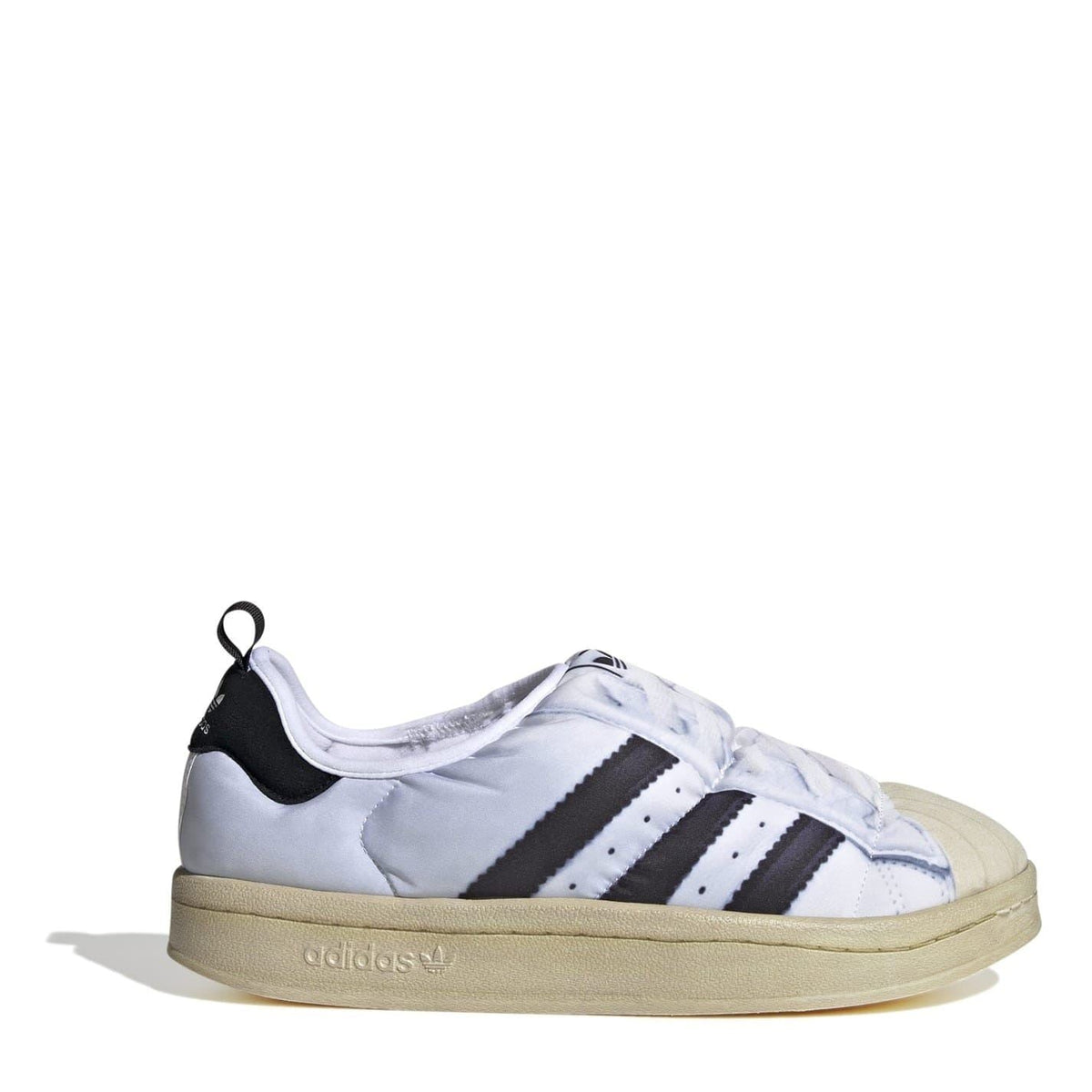 adidas Originals Puffy Spr trainers with three stripes, showcasing the sporty footwear design and white and black color scheme