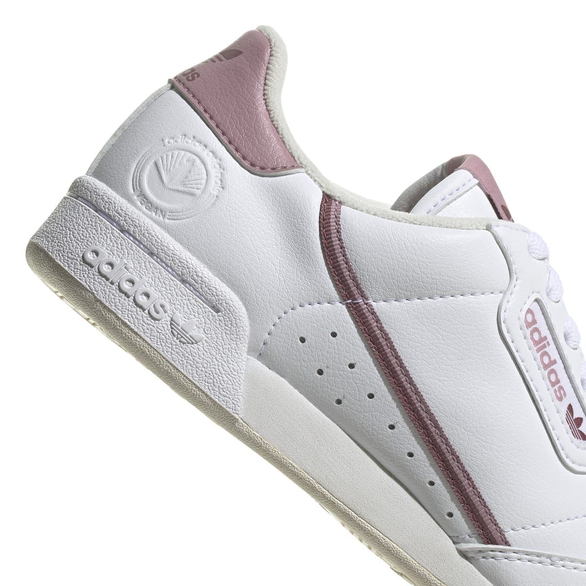 Women's white vegan trainers close-up of heel cup with mauve collar panel