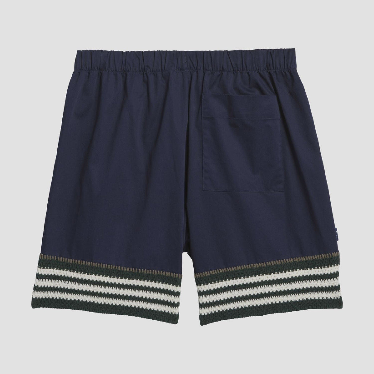 Indigo knit shorts back view with elastic waistband and striped hem