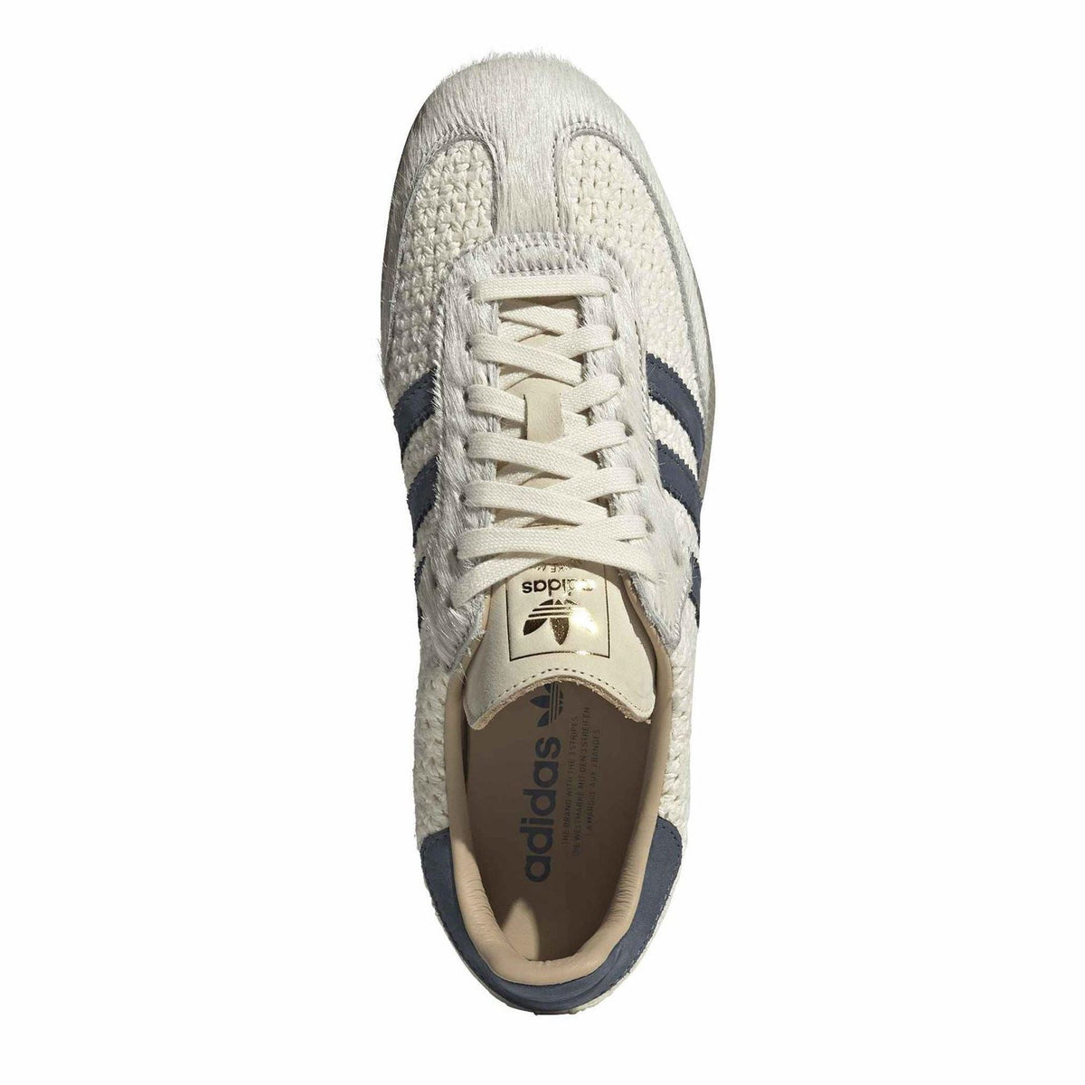 Cream lace-up sneaker with navy accents and adidas tongue label