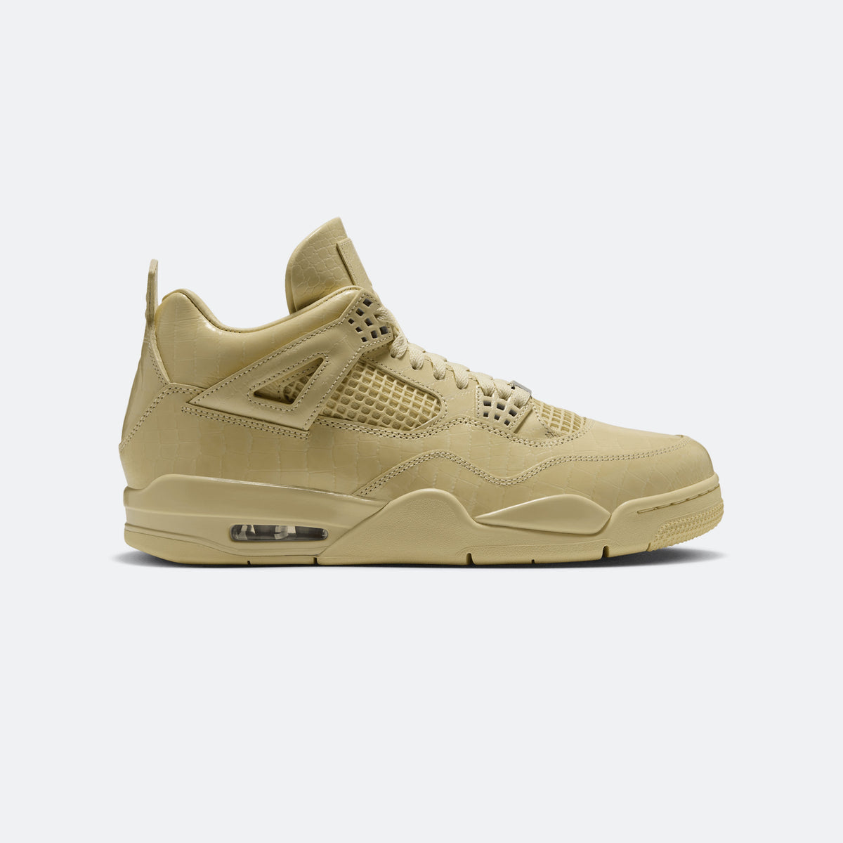 Yellow low-top athletic sneaker with mesh panels and lace-up closure