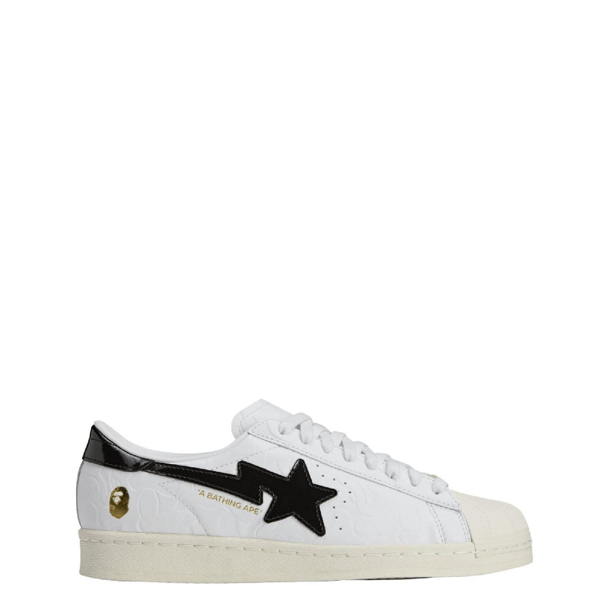 White Adidas Originals SSTR sneaker with black star logo and gold heel detail