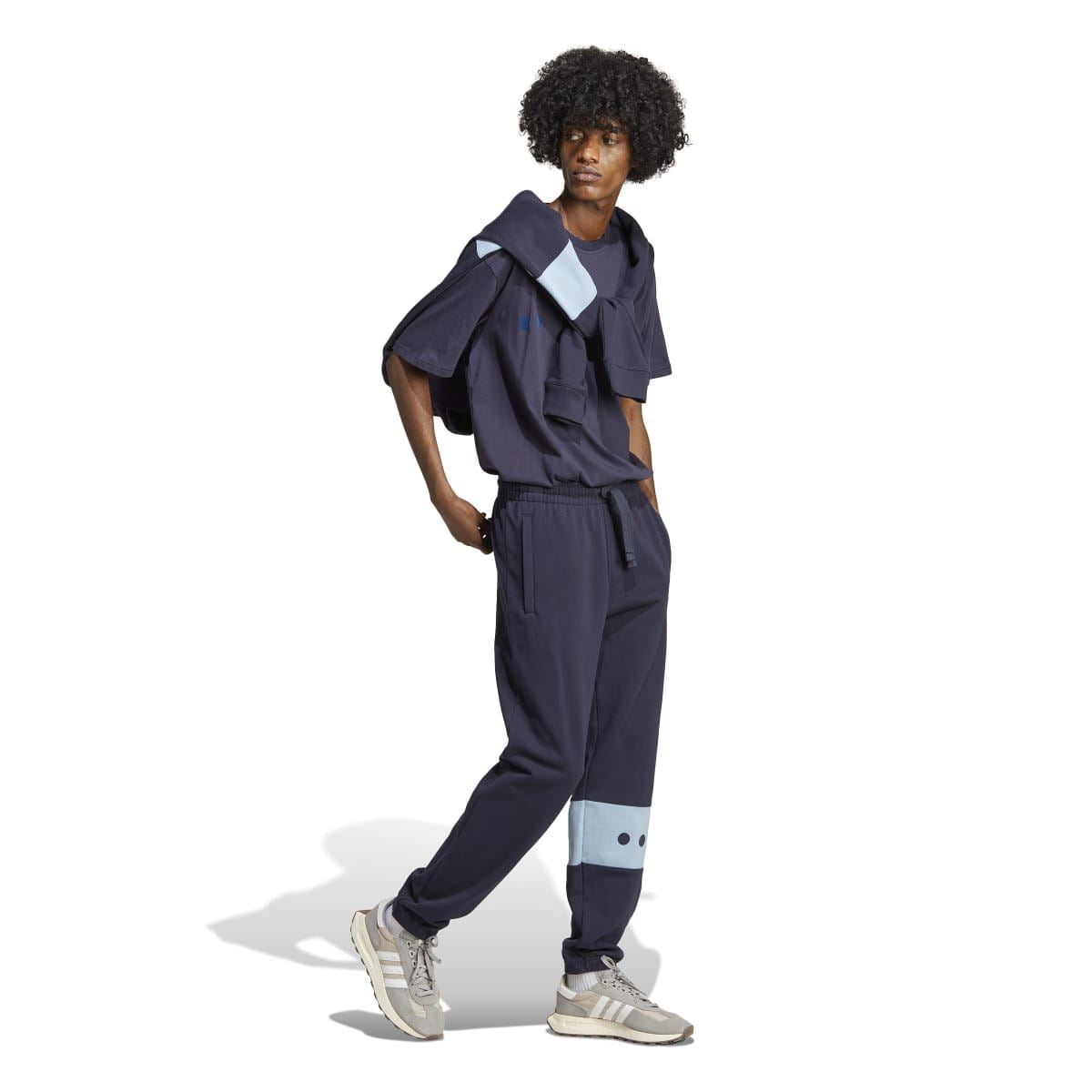 Navy joggers with light-blue band featuring Adidas trefoil graphic on the lower leg