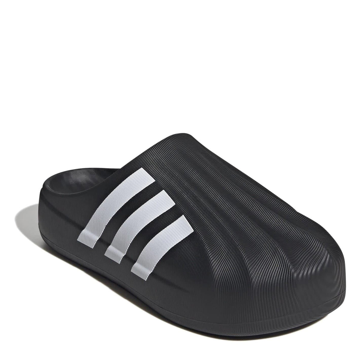 Black adidas slide slippers, angled view with three white stripes on the side.