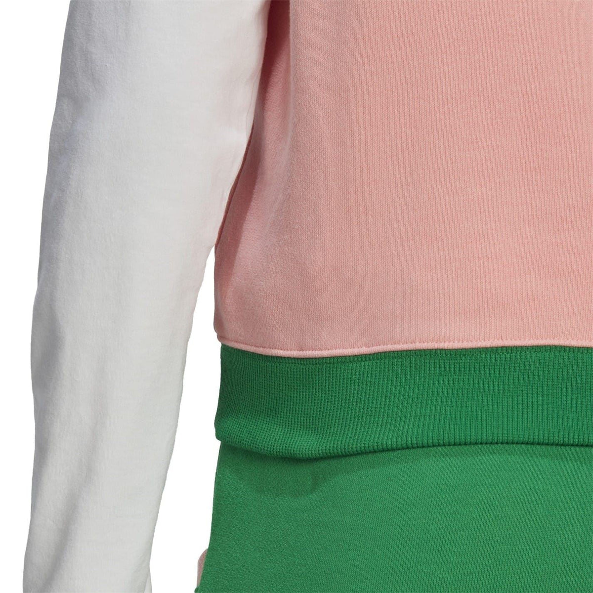 adidas Originals Adicolour 70s sweater vest featuring colorful knit pattern and classic fit, worn over a shirt.