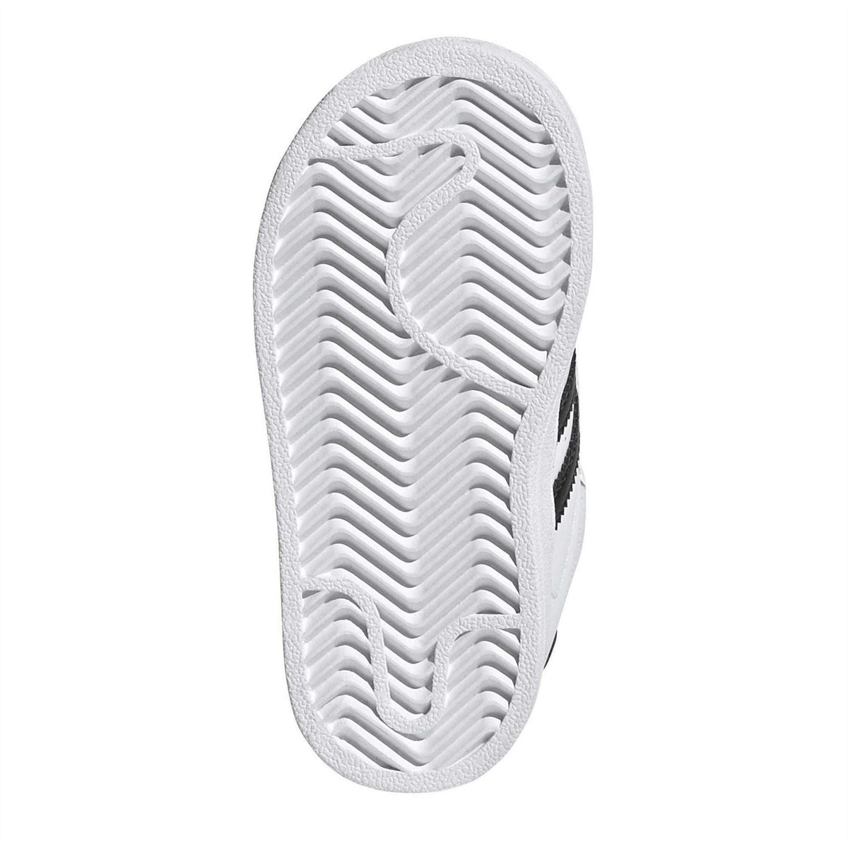 White outsole of low-top sneakers with zigzag tread pattern