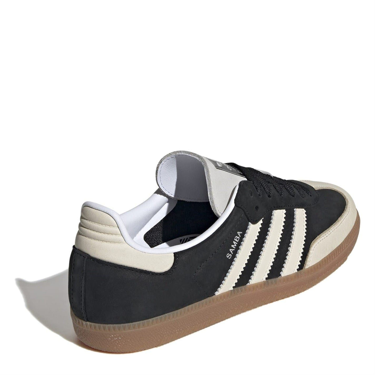 Black and beige low-top sneakers, rear view with heel tab and three white stripes