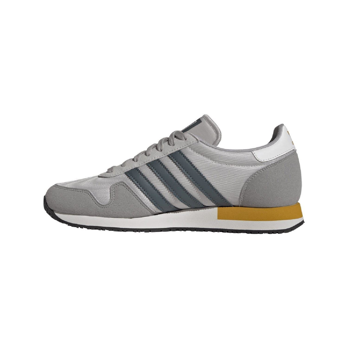 Light grey adidas USA 84 trainers with blue three stripes and yellow heel edge