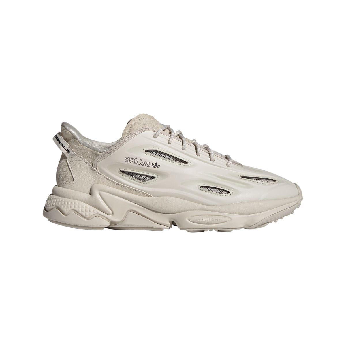adidas Ozweego trainers in light cream with suede panels, lace-up front, and perforated details