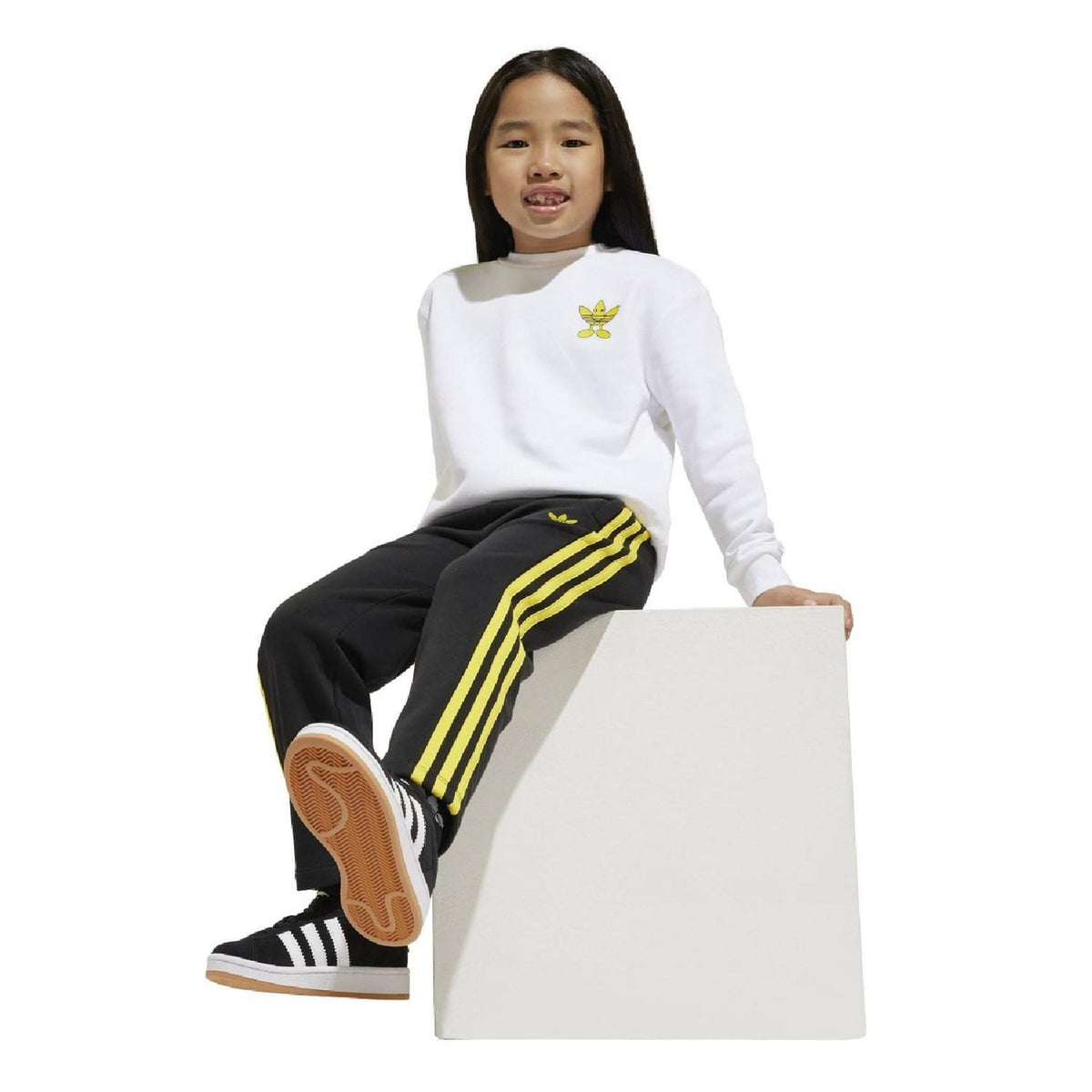 Kids crewneck sweatshirt and track pants set: white top with yellow logo, black striped pants