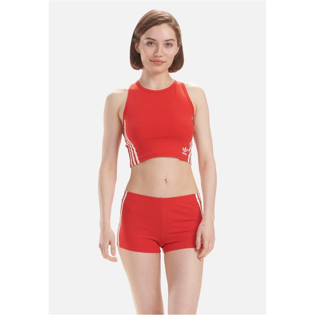 Red sleeveless cotton crop top with adidas logo and white side stripes