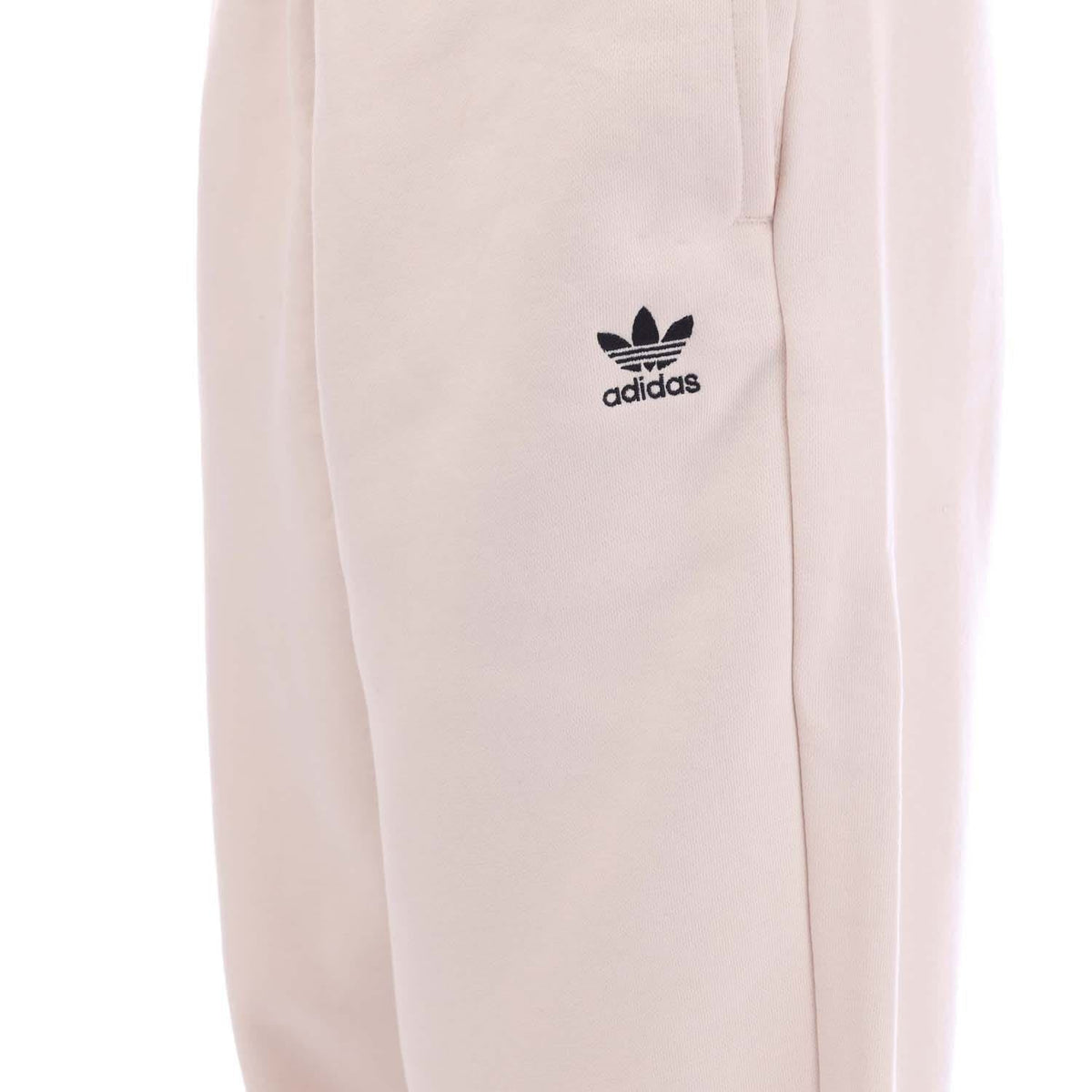 Off-white fleece joggers with adidas logo patch on upper thigh