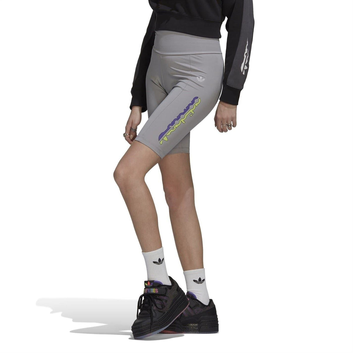 Light gray short leggings with colorful vertical logo graphic on the leg