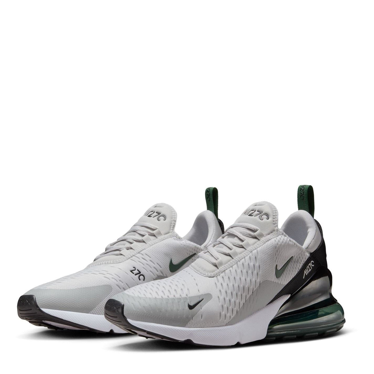 Nike Air Max 270 trainer pair in white with green heel accents and black detailing