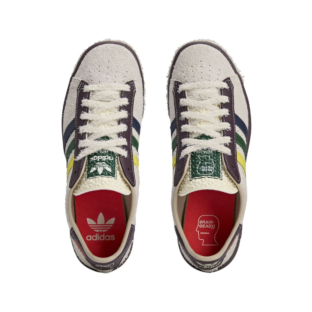 White suede sneakers with white laces and contrast patch at tongue; red interior