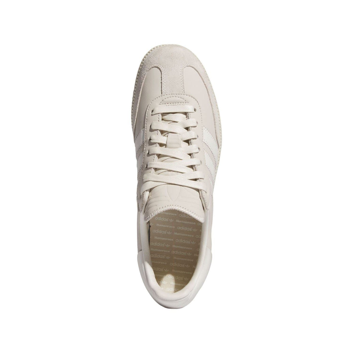 White leather trainers, toe and lace view, with textured overlays and stitching