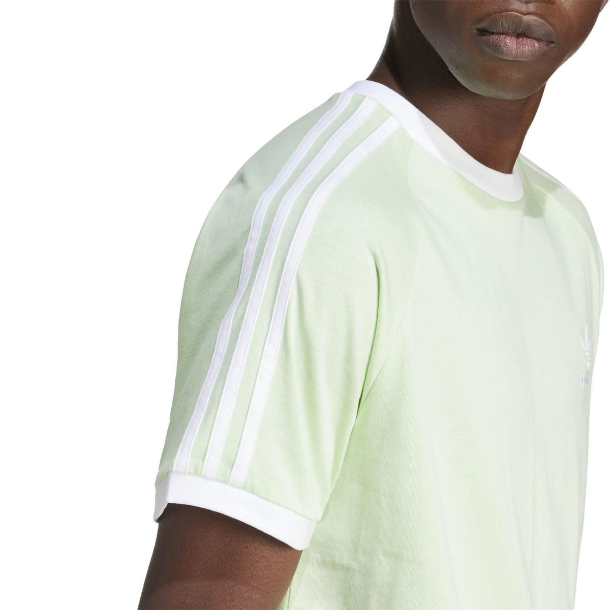 Light green adidas T-shirt sleeve with white 3-Stripes panel and crew neckline detail