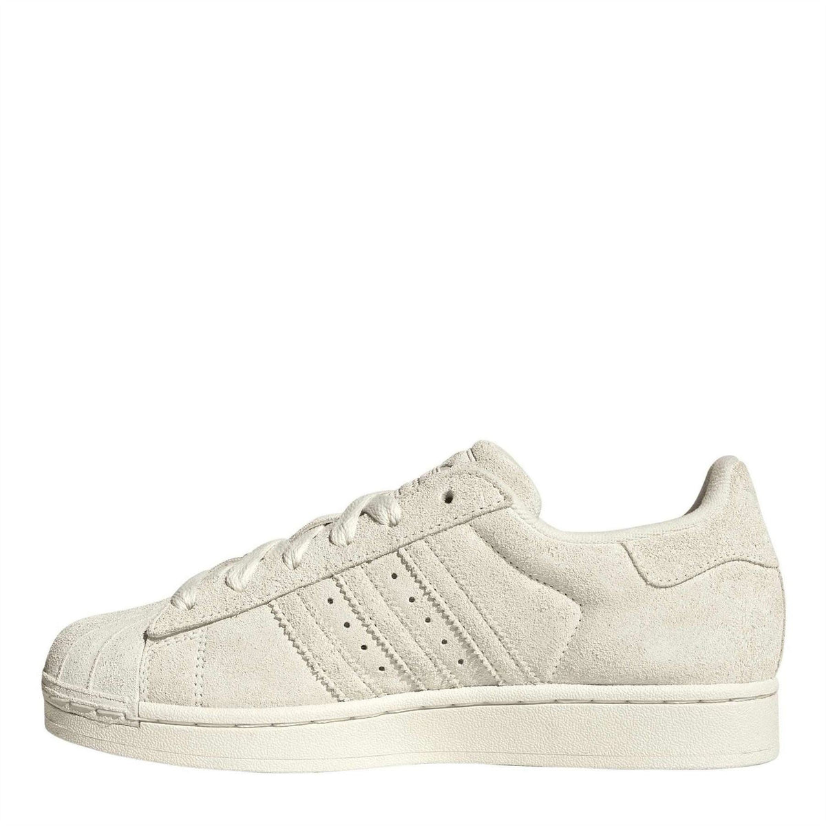 Light cream suede Adidas Originals-style low-top sneakers, side view with three stripes