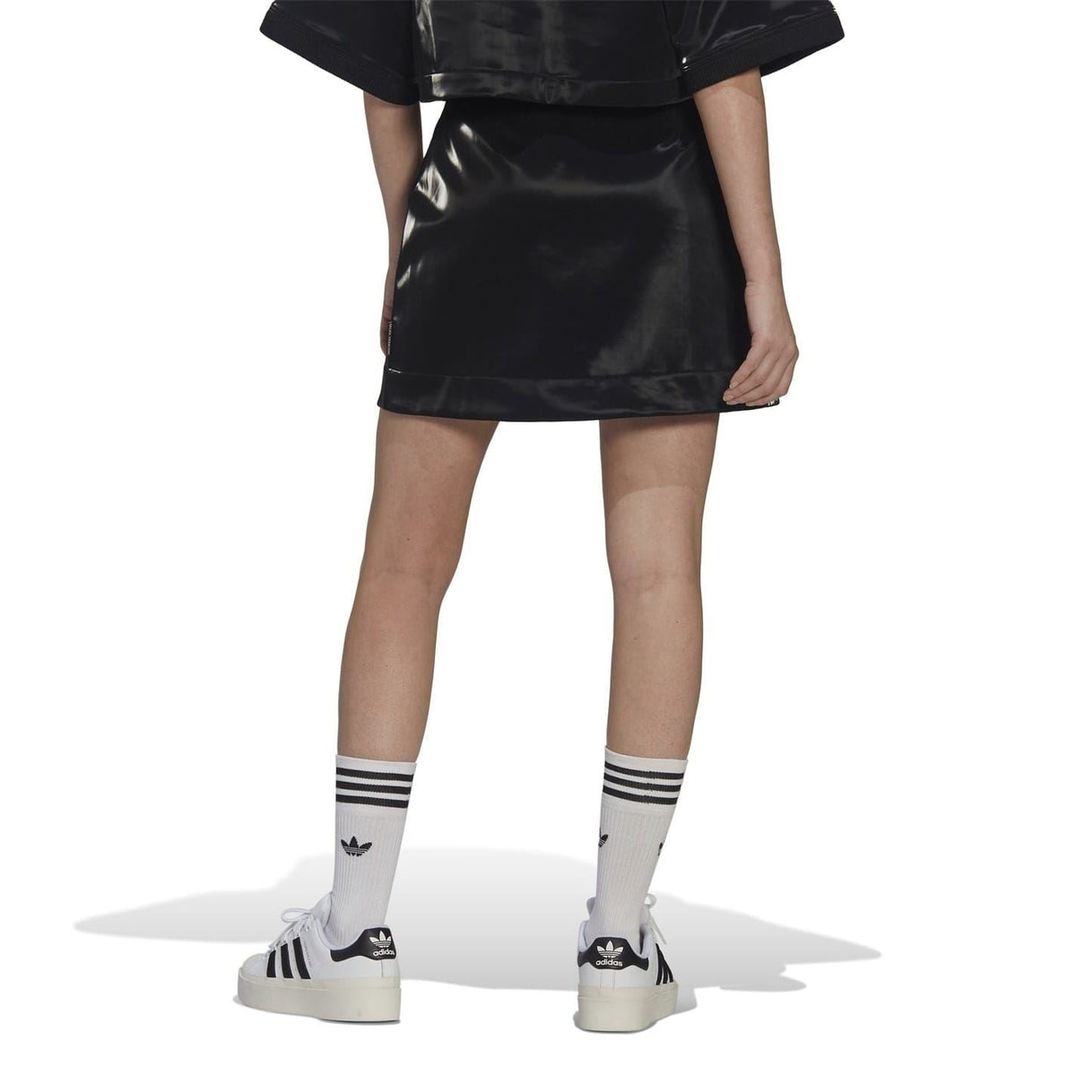 Black glossy mini skirt with straight hem and side seam panels