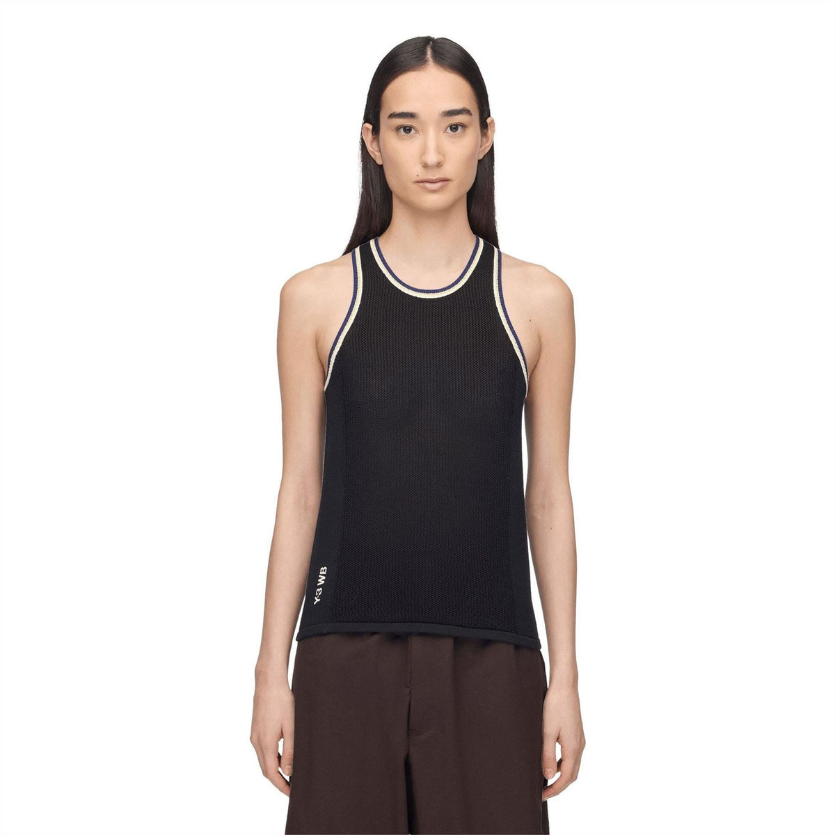 Black knit tank top with crew neck and contrast trim, worn by model