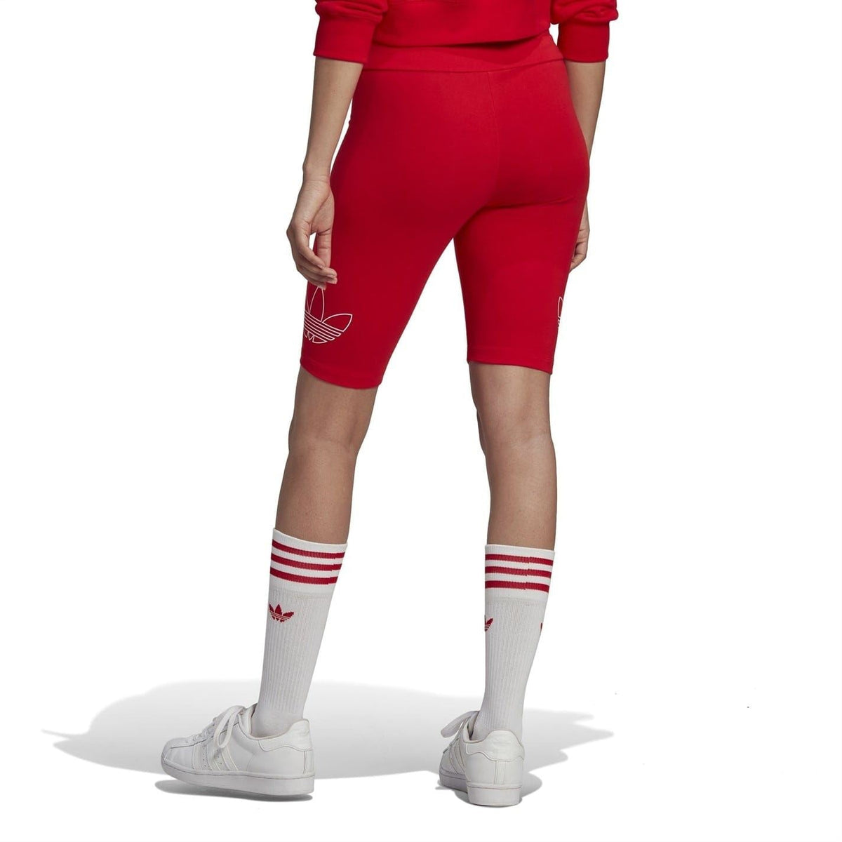Red slim-fit biking athletic shorts showing side profile and trefoil logo