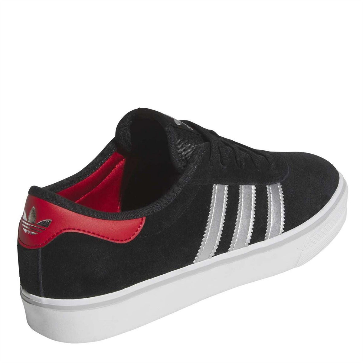 Black suede low-top sneaker rear quarter view with red collar trim and white stripes.