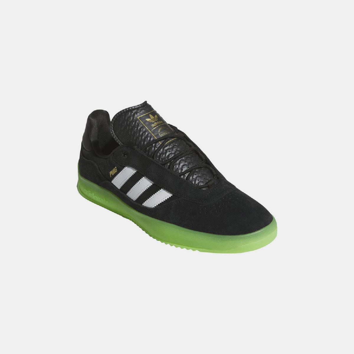 Black suede-style trainers with white stripes and bright green sidewall sole
