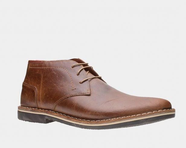 Harken cognac leather lace-up ankle boot with stitched panels and dark rubber sole.