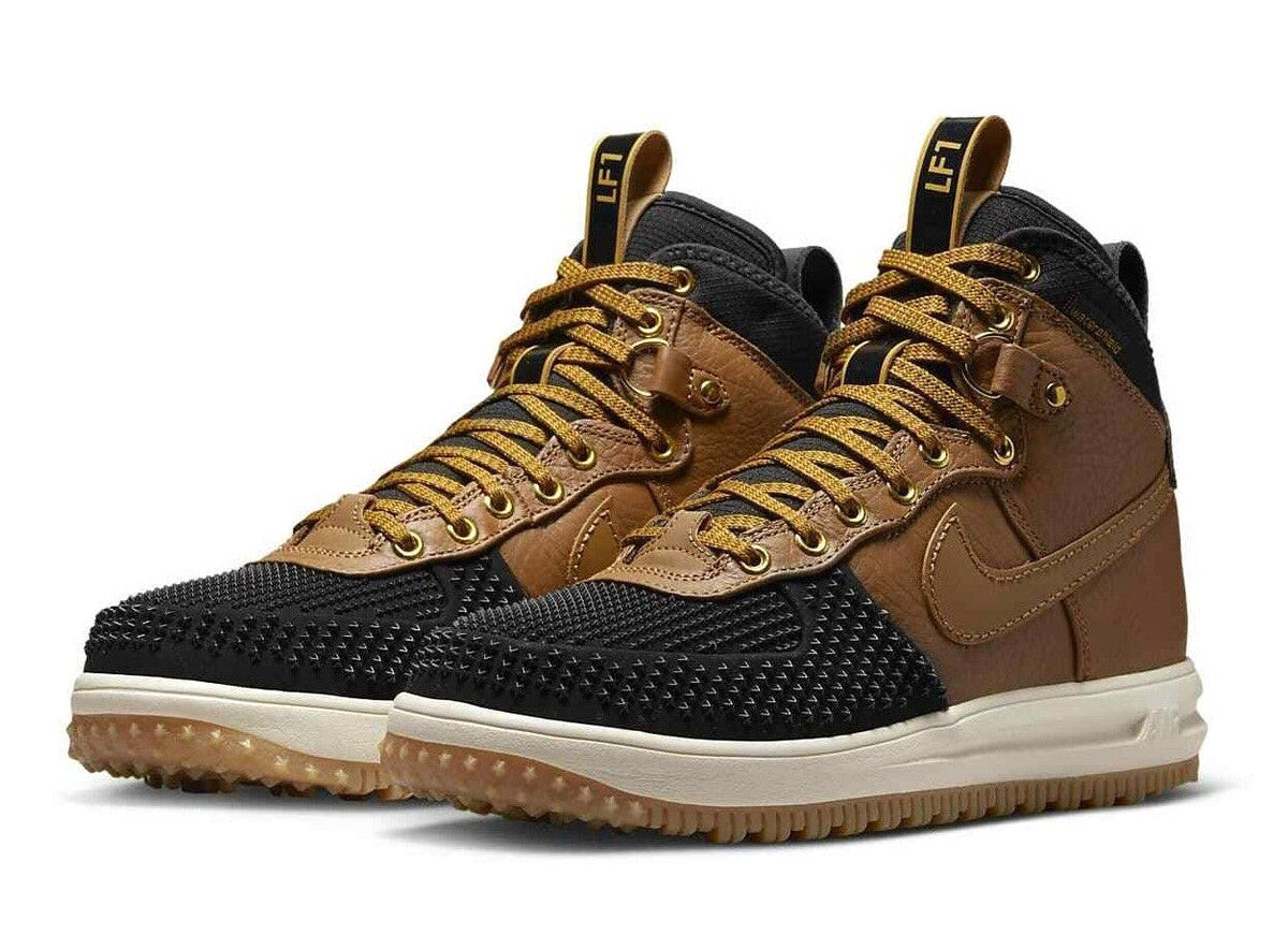 Pair of Men's Nike duckboots in ale brown and black with lace-up closure and rubber sole