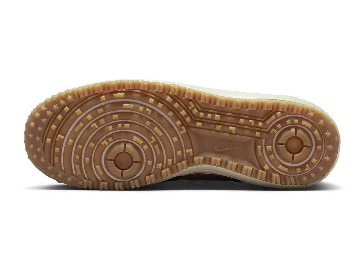 Men's Nike duckboot outsole with rugged tread for traction in brown
