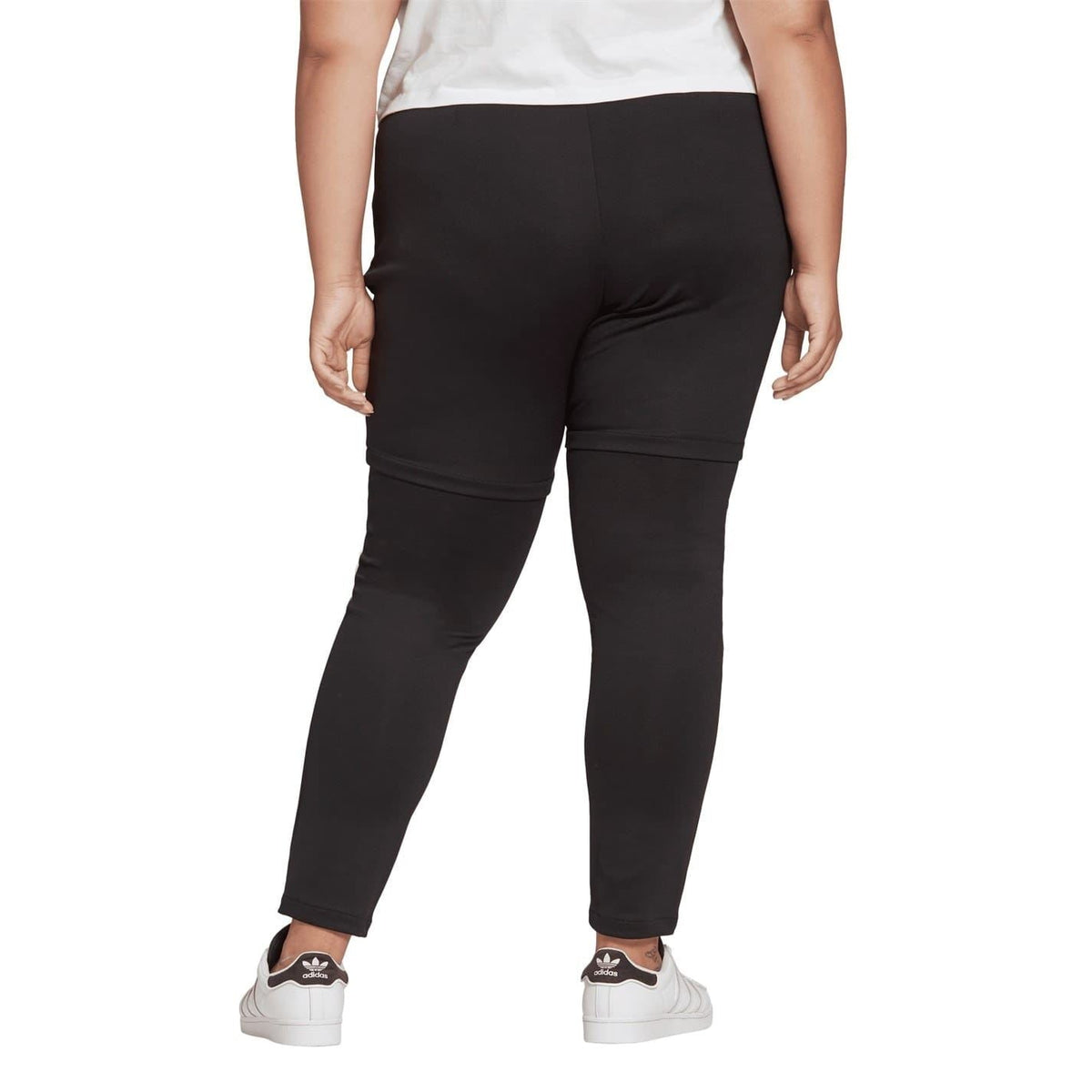 Black slim-fit legging pant with back panel seam and ankle-length tapered legs