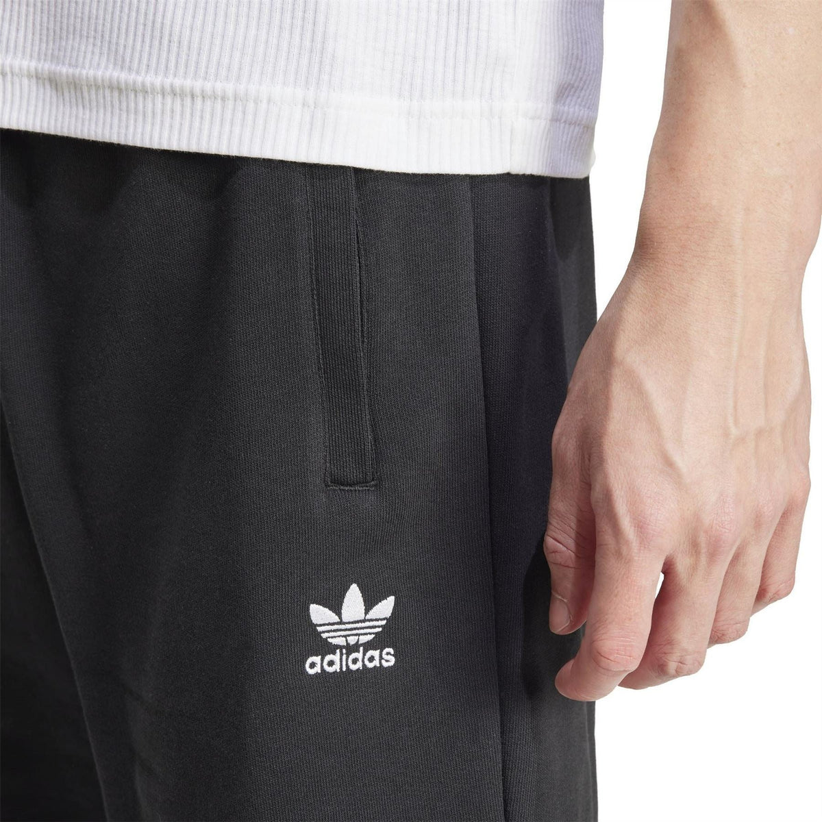 Black sweat shorts with adidas logo on thigh and front seam detail