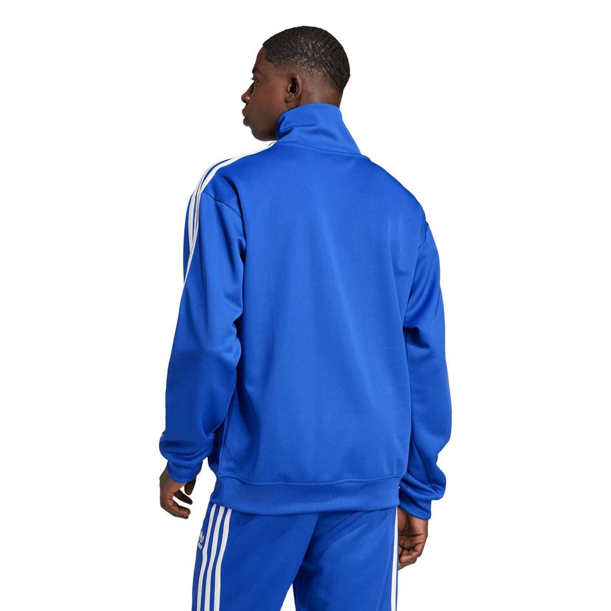 Blue track jacket with funnel neck, back zip, white sleeve stripes, adidas branding.