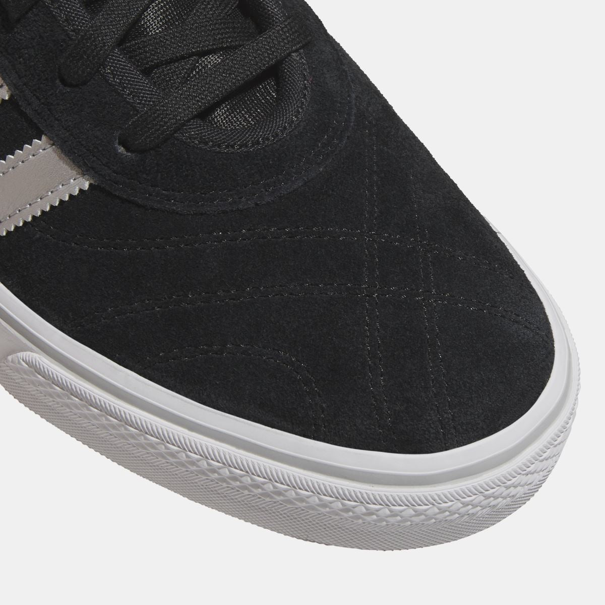Close-up of adidas Originals Adi Ease black suede upper with white sidewall midsole