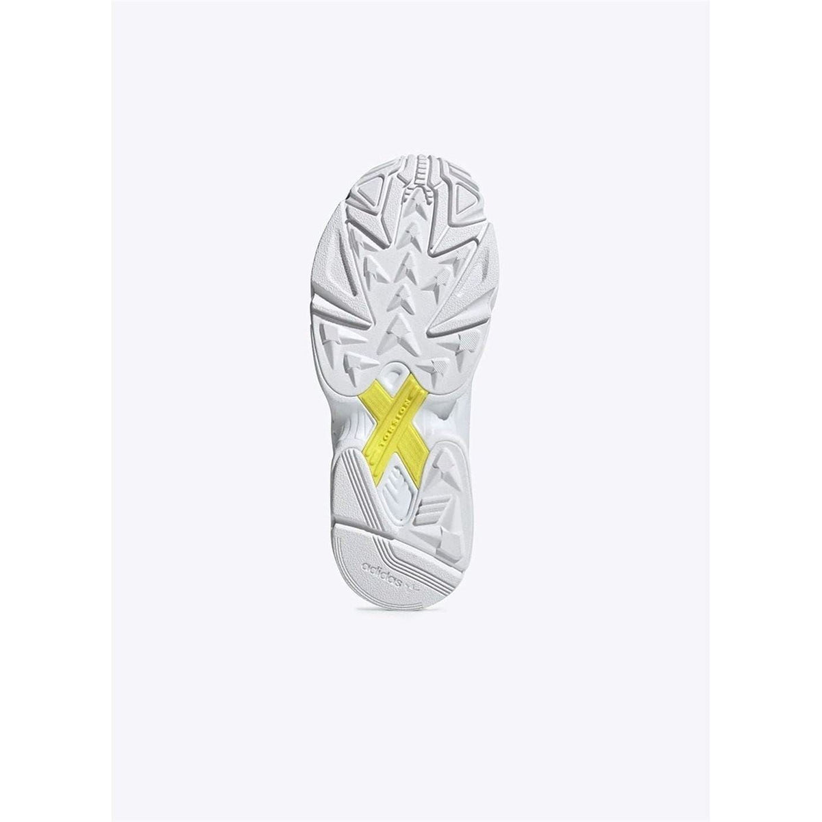 White adidas sneaker outsole with textured tread and yellow accent