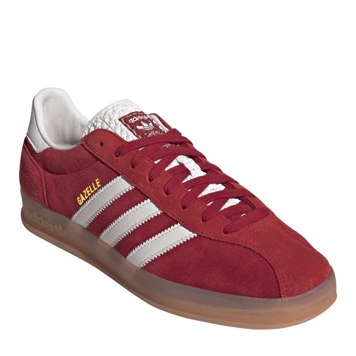 Red suede low-top trainers with white stripes, lace-up front, and Gazelle side label