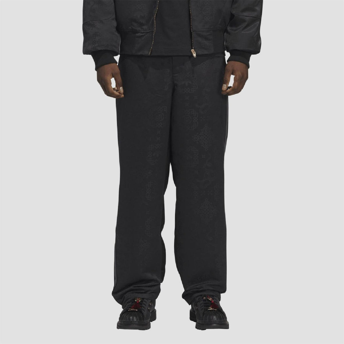 Black allover print track pants with straight fit and elastic ankle cuffs