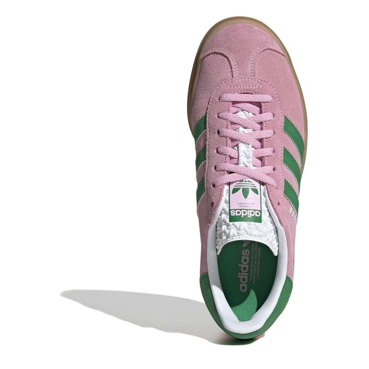Pink suede low-top sneakers with lace-up, green heel tab, adidas logo